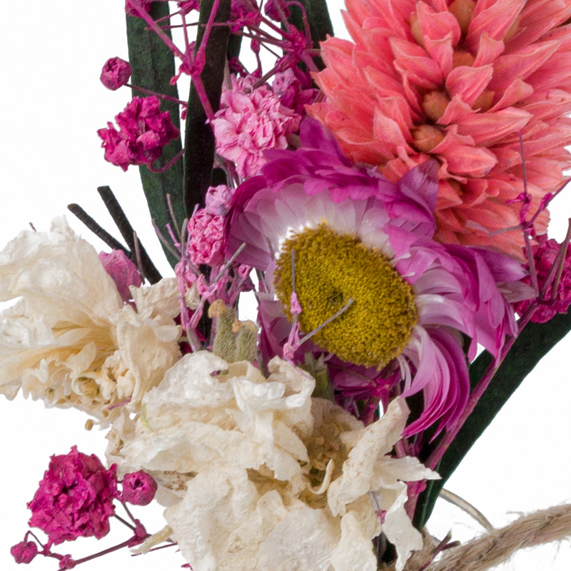 A close up of a pink dried flower mini bouquet