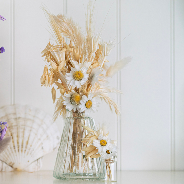 White bouquets made from dried flowers that are not toxic to pets in their vases