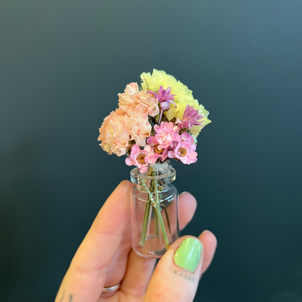 A summer-inspired mini bouquet in a mini vase