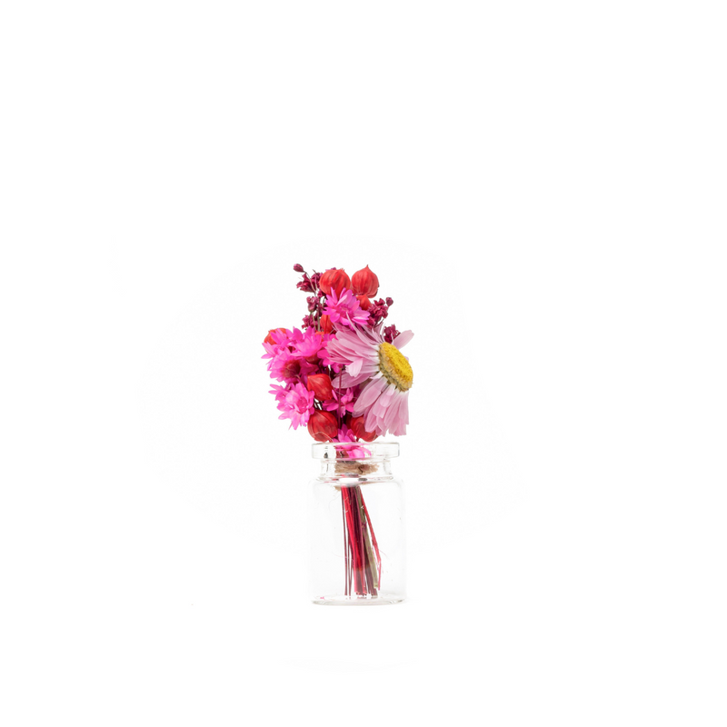 Pink and red dried flower mini bouquet in a mini vase