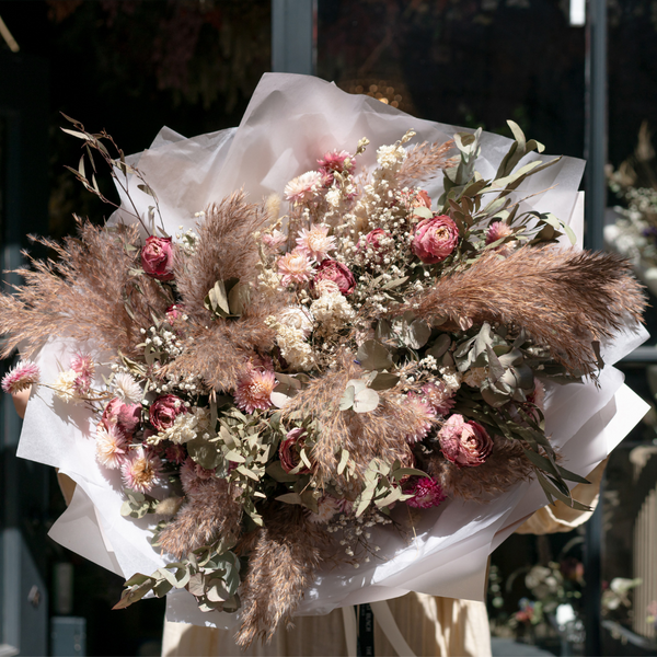 A giant pink dried flower bouquet