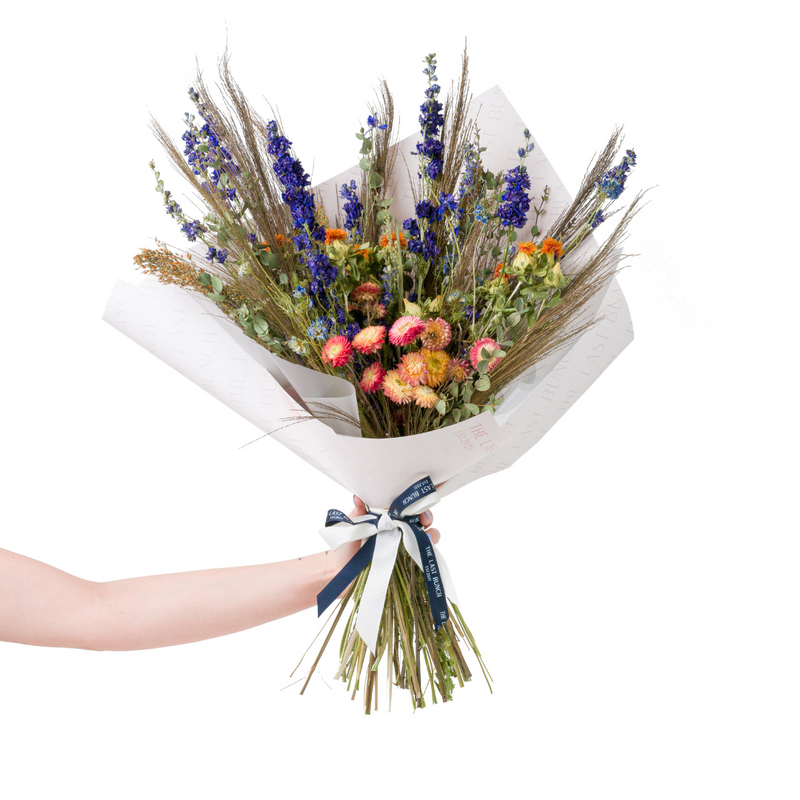 A blue and orange dried flower bouquet