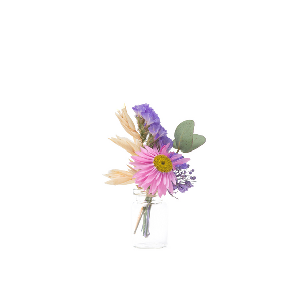 A pink and purple dried flower mini bouquet in a mini vase