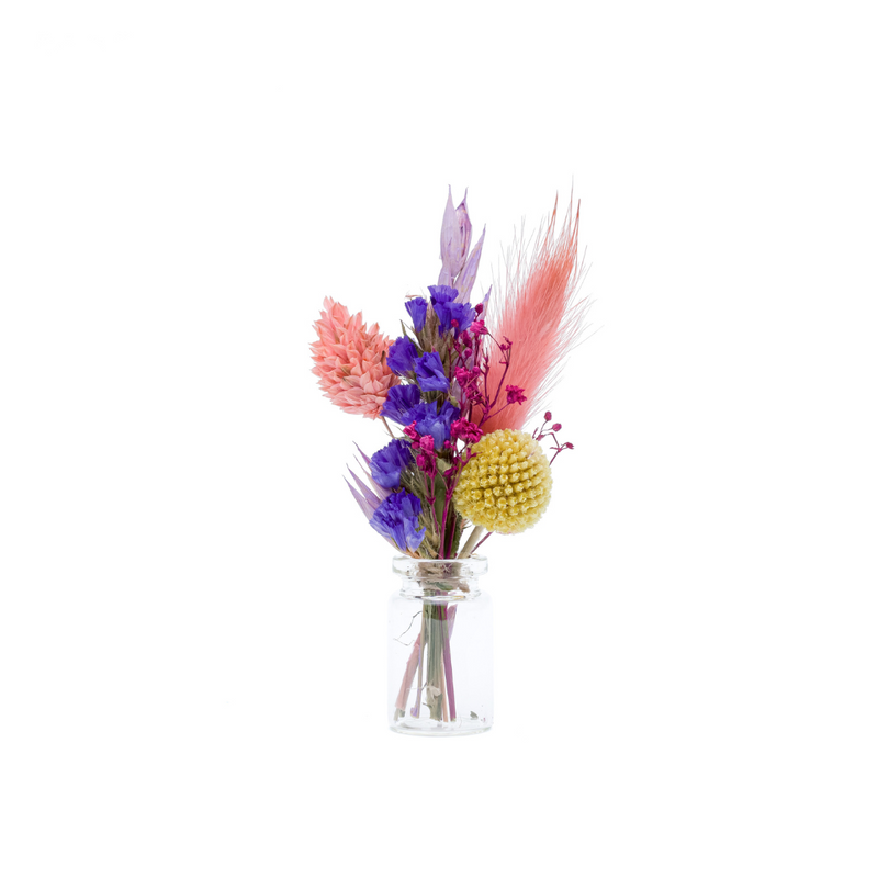 A bright colourful dried flower mini bouquet in a mini vase