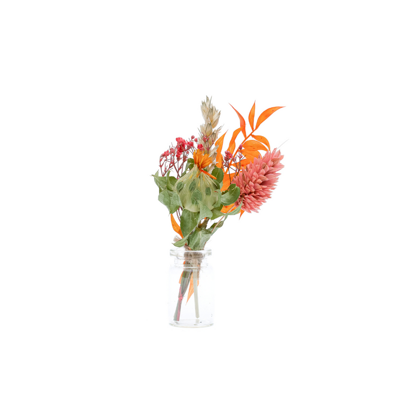 A orange dried flower mini bouquet in a mini vase